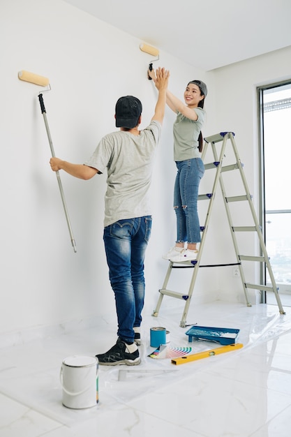 Couple finishing painting