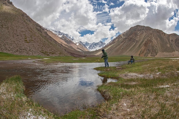 Couple fishing in the Andes mountains