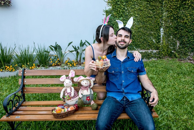 Couple in garden with basket of easter eggs