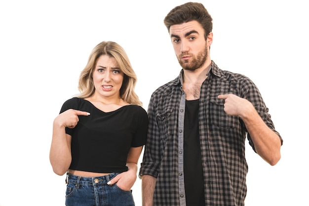 The couple gesturing on the white background