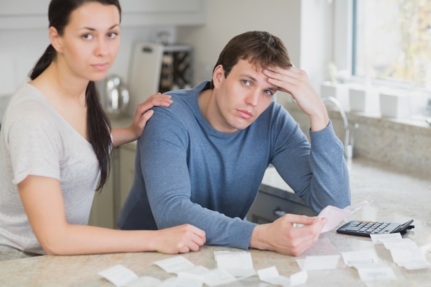 Couple getting stressed over bills