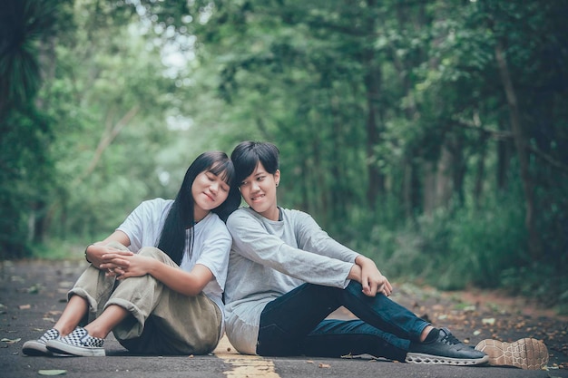 Couple of girl with girlLGBT Pride month conceptAsian Handsome male make up and wear woman clothGay Freedom DayPortrait of Nonbinary on white background