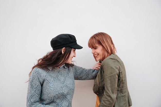 Couple of girls on white background enjoying life