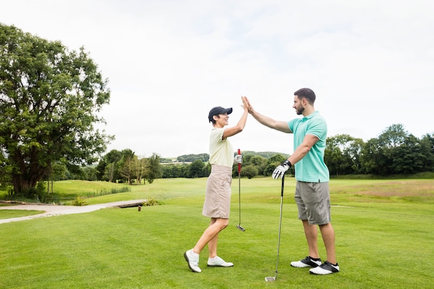 Couple giving high five to each other