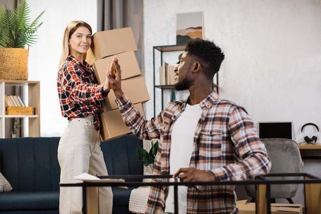 couple giving high five during home interior renovation