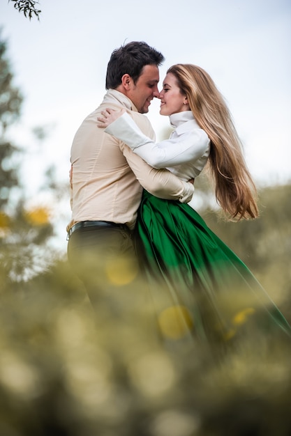 Couple in the green forest