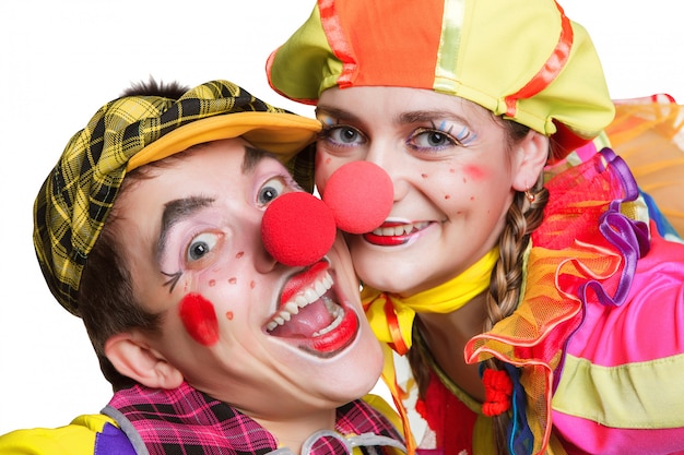 Couple of happy clowns isolated on white background