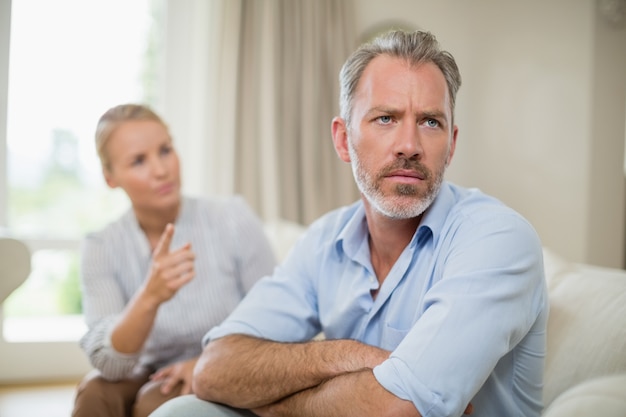 Couple having an argument in living room