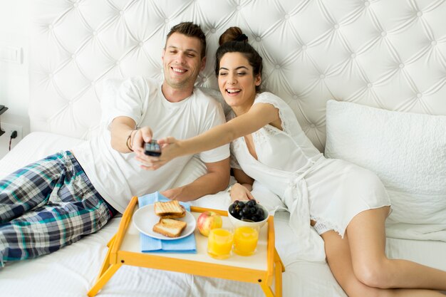 Couple having a breakfast in bed