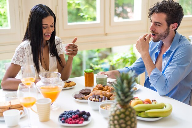 Couple having breakfast at home