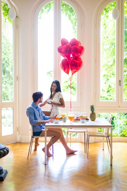 Couple having breakfast at home