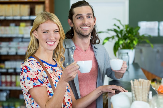 Couple having coffee in supermarket cafÃ©