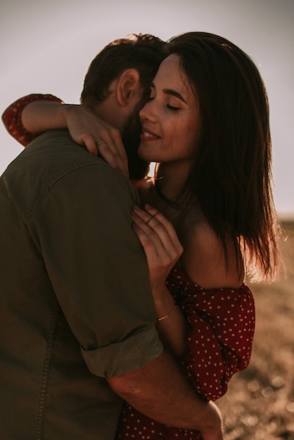 Couple having fun in a summer field