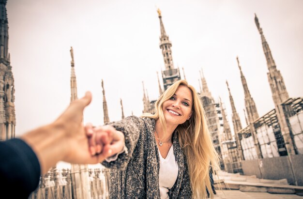 Couple having fun on the top of duomo cathedral