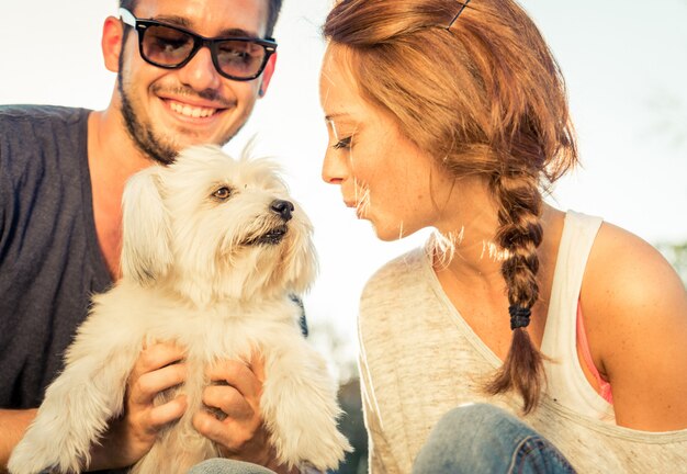 Couple having fun with their dog