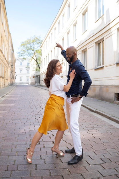 Couple having a latin dance performance in the city