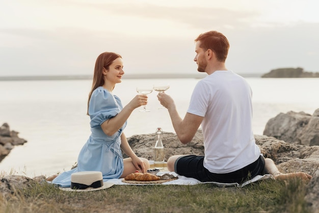 A couple having a picnic on the beach