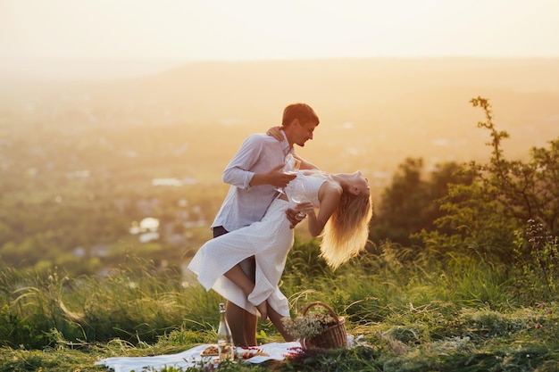 couple having a picnic at the hill