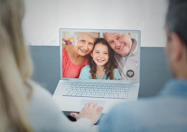 Photo couple having video chat on laptop