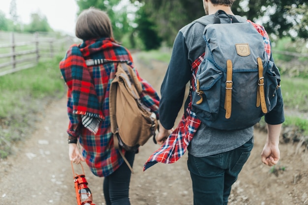 Couple hiking holding hands