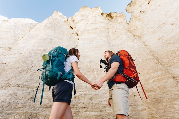 Couple hiking together in the wilderness