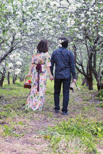 Couple hold hand walk park