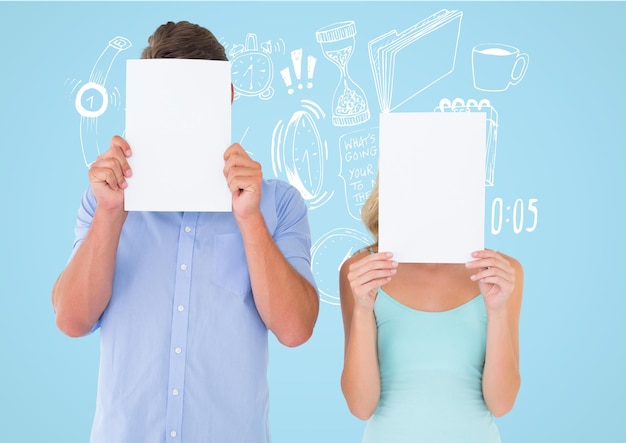 Couple holding blank page in front of their face against blue background