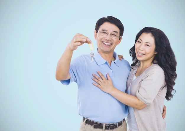 Couple Holding key in front of vignette