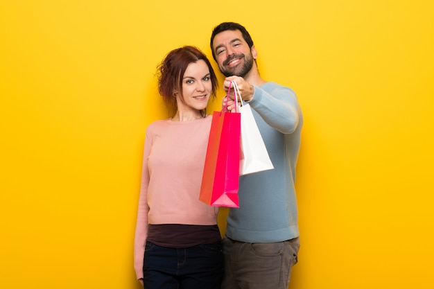 Couple holding a lot of shopping bags