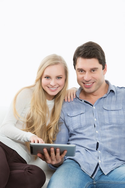 Couple holding touchpad. Home schooling.