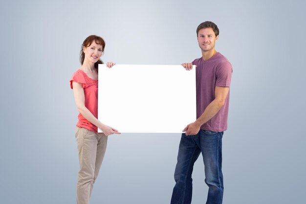 Photo couple holding a white sign against grey vignette