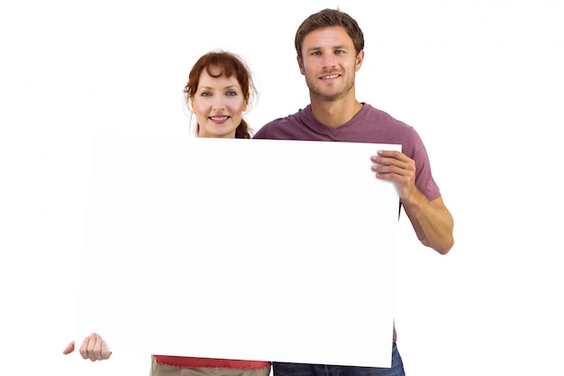 Couple holding a white sign