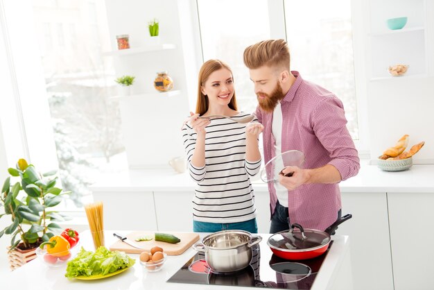 Couple at home cooking together