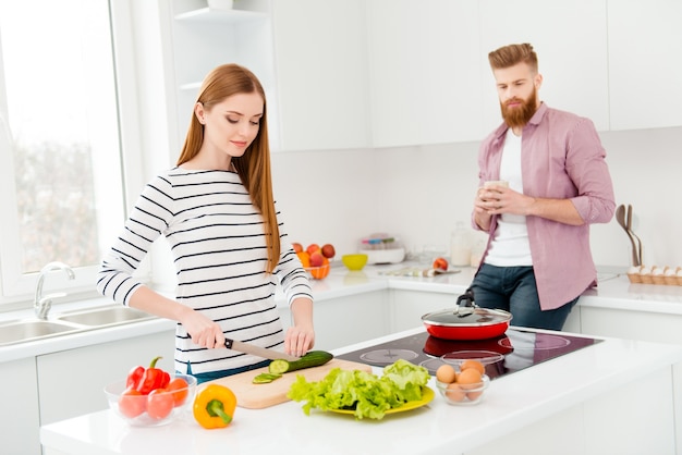 Couple at home cooking together