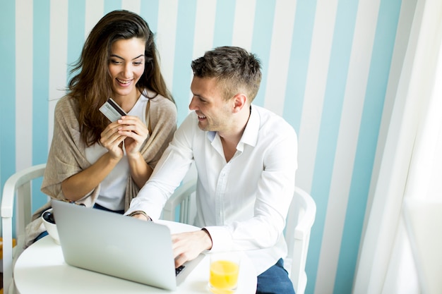 Couple at home shopping online