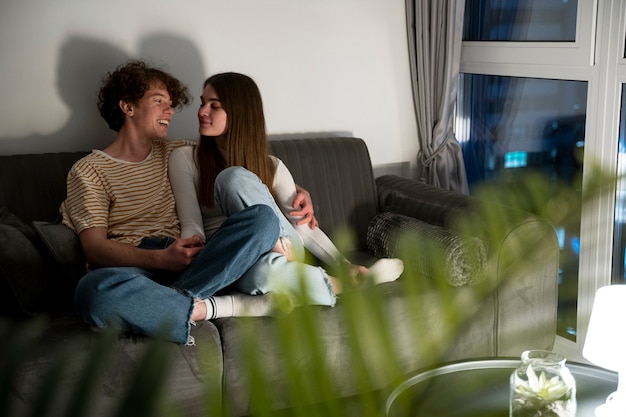 Photo couple at home sitting on the couch together