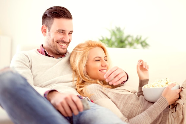 Couple at home watching TV