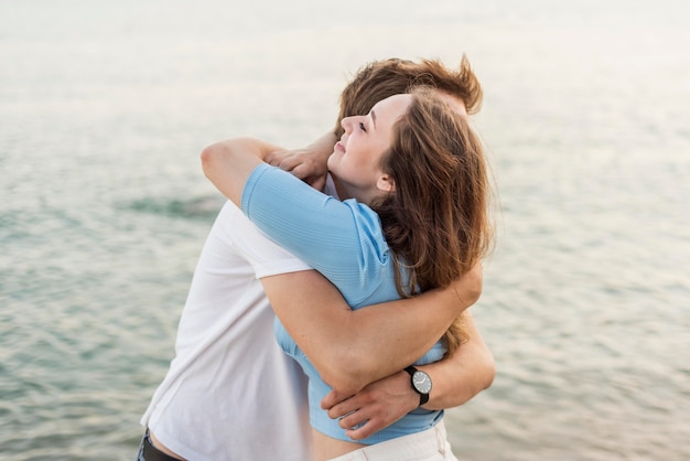 Couple hugging after the end of the pandemic