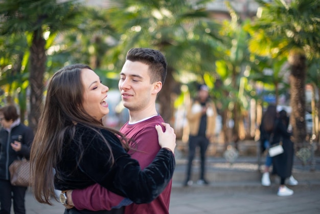 Couple hugging in a city street