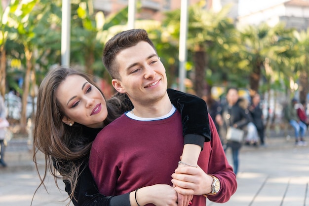 Couple hugging in a city street