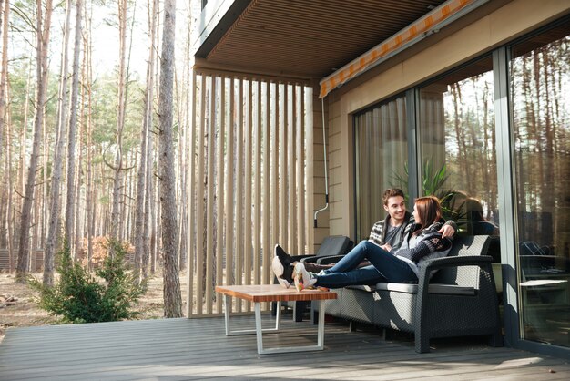 couple hugging on Black Outdoor Couch
