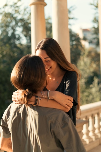 Couple hugging each other outdoors