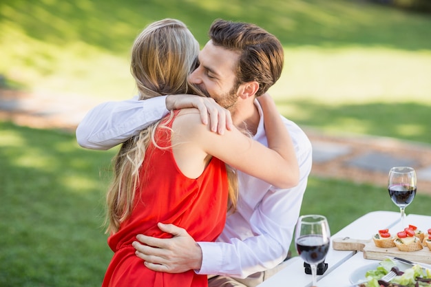 Couple hugging each other in the restaurant