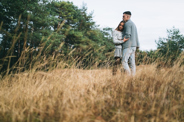 couple hugging in a forest