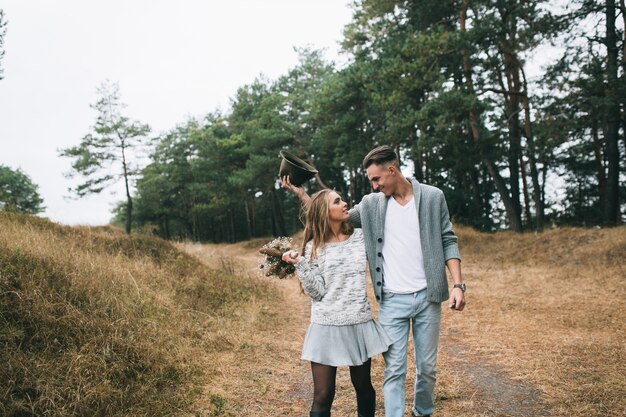 couple hugging in a forest