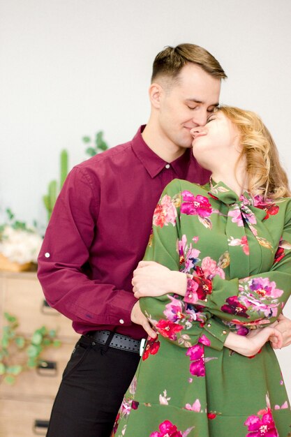 Couple hugging at home