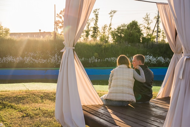 Couple hugging in nature back view outdoor