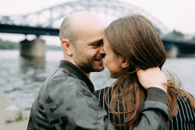 Couple hugging on a pier