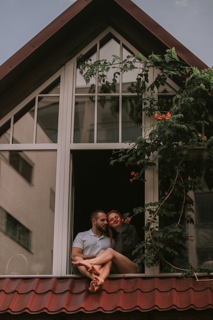 Couple hugging in wooden house