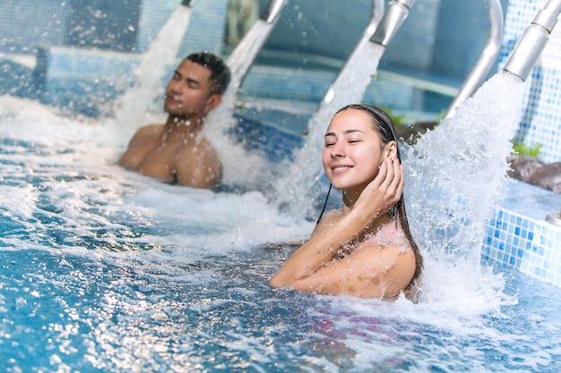 Couple in hydrotherapy pool